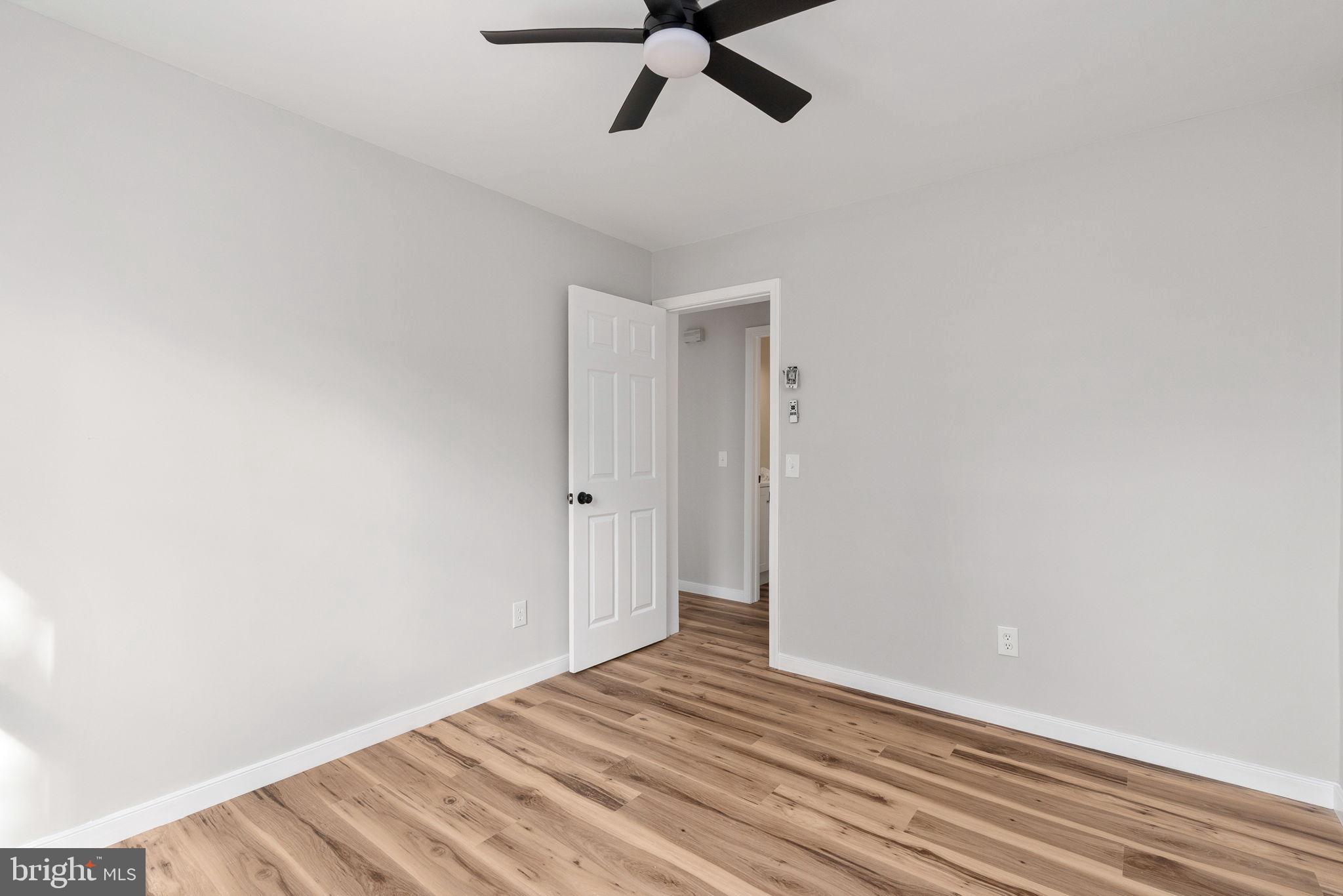 2174 Copper Line Road Bumpass, VA 23024 - Photo 22 of 45 a view of empty room with wooden floor