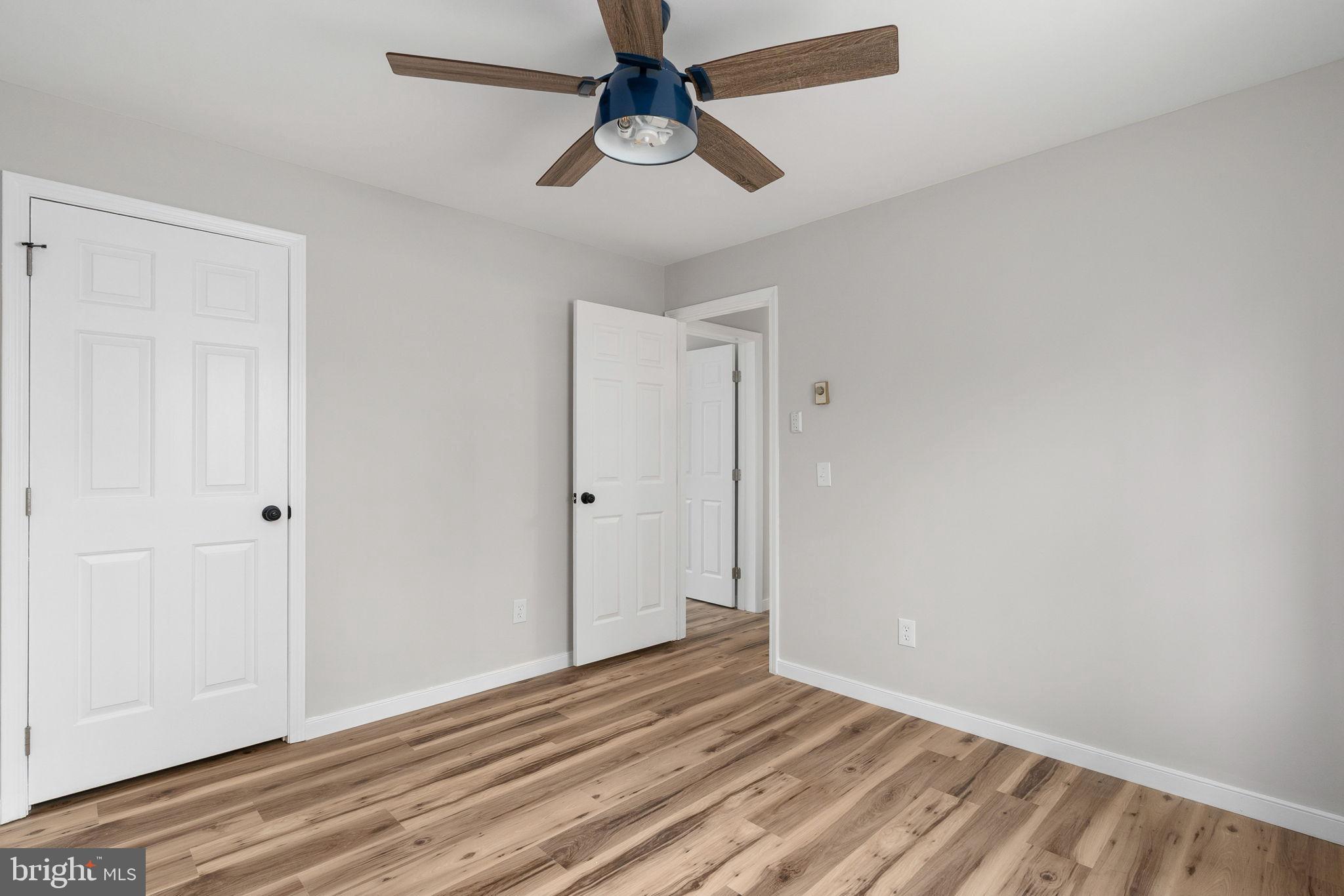 2174 Copper Line Road Bumpass, VA 23024 - Photo 25 of 45 a view of room with wooden floor and ceiling fan