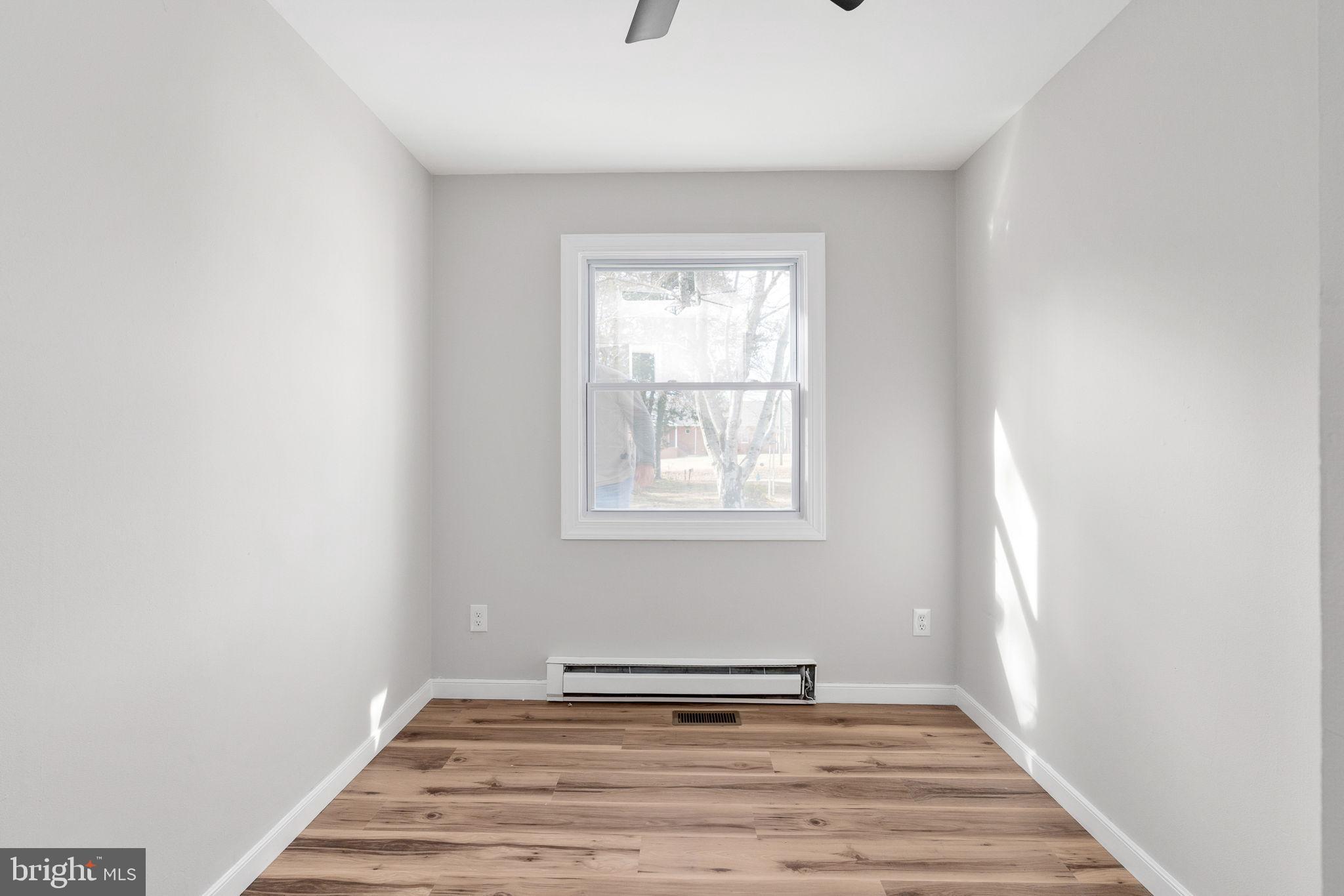 2174 Copper Line Road Bumpass, VA 23024 - Photo 27 of 45 a view of a livingroom with wooden floor and a window