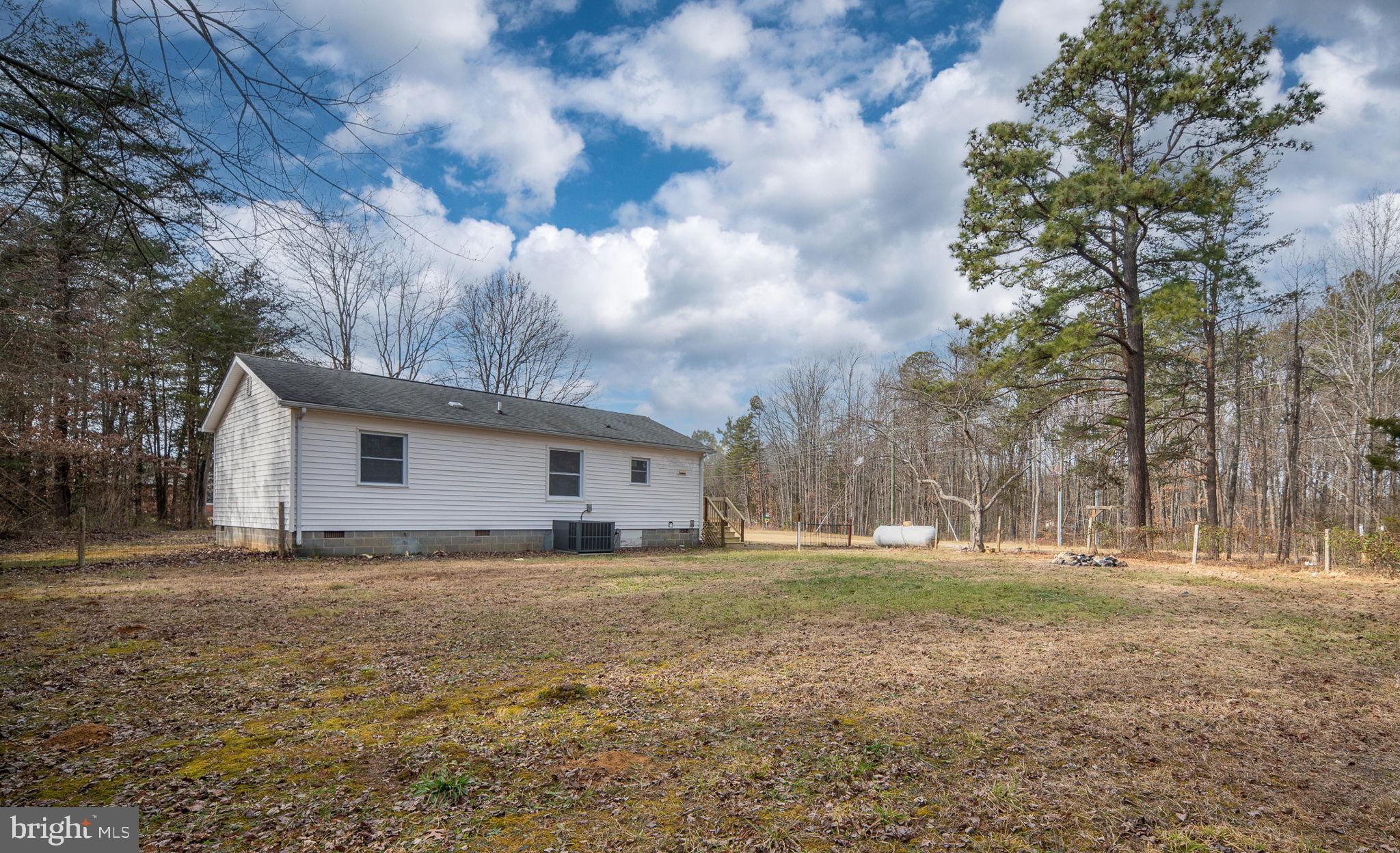 2174 Copper Line Road Bumpass, VA 23024 - Photo 39 of 45 a view of yard with tree in the background