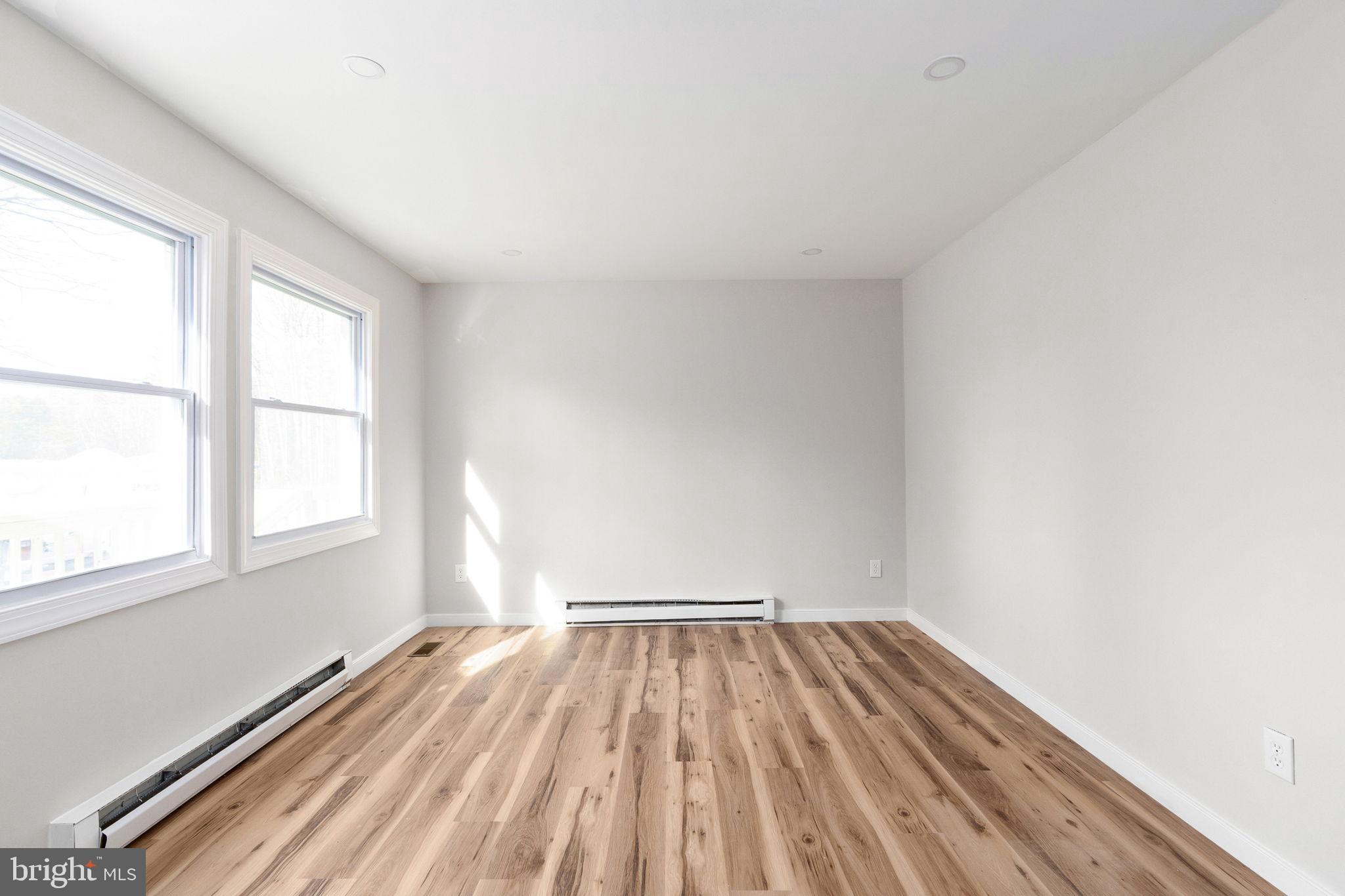 2174 Copper Line Road Bumpass, VA 23024 - Photo 4 of 45 a view of a room with wooden floor and window