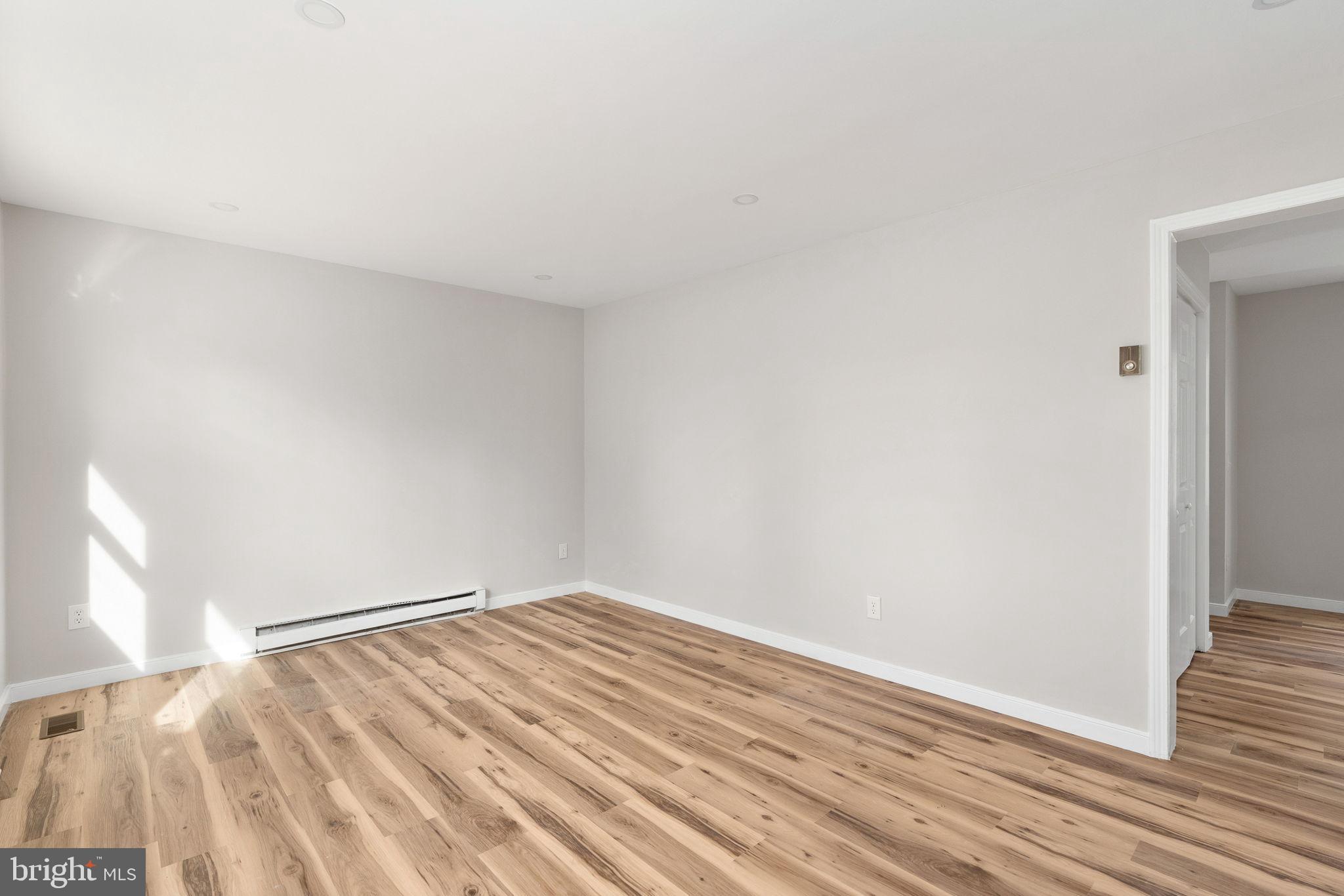 2174 Copper Line Road Bumpass, VA 23024 - Photo 8 of 45 a view of empty room with wooden floor