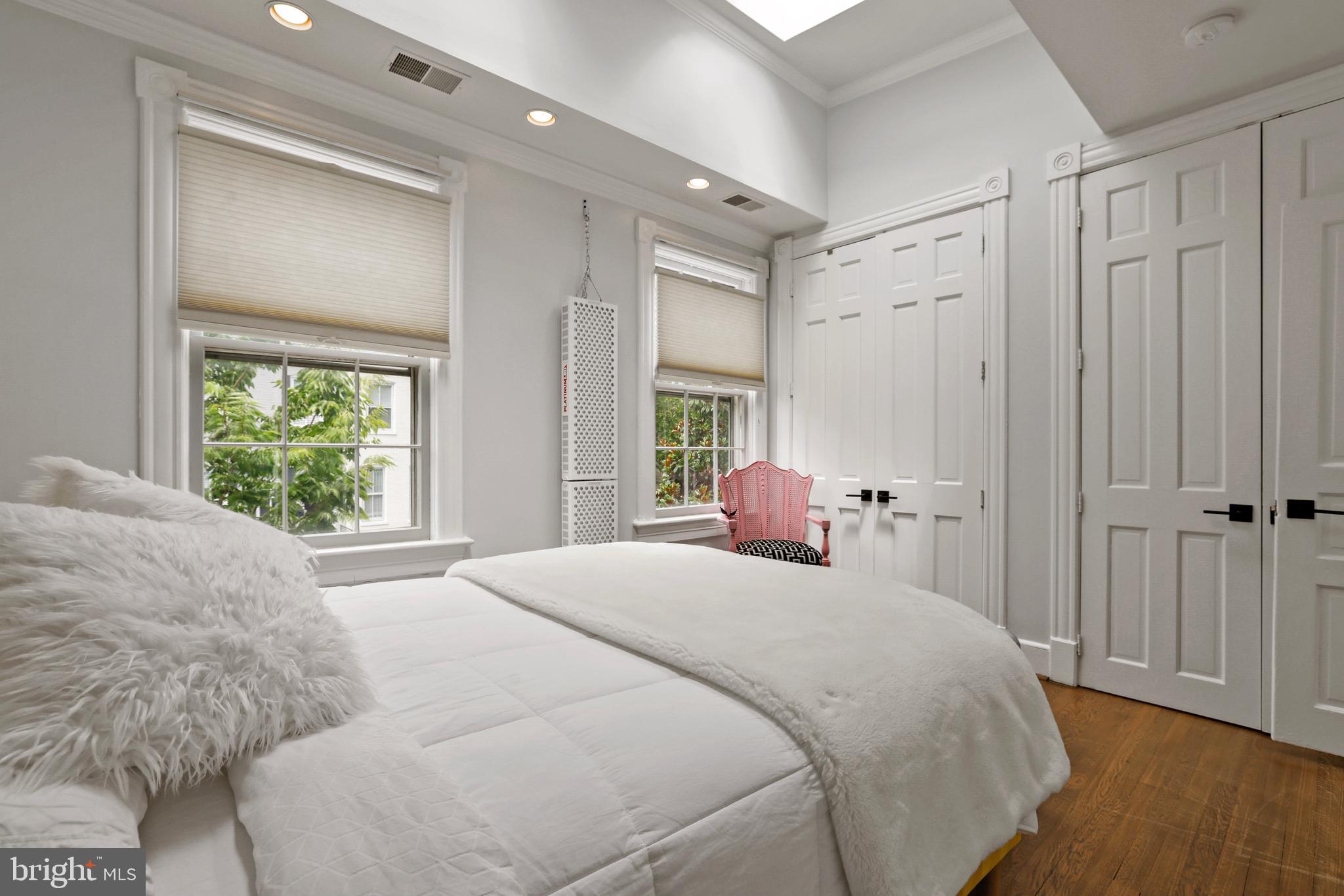 1215 33rd Street Northwest Washington, DC 20007 - Photo 16 of 37 a bedroom with a bed and a window