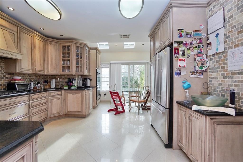 914 Avenue L Brooklyn, NY 11230 - Photo 13 of 27 a large white kitchen with lots of counter top space