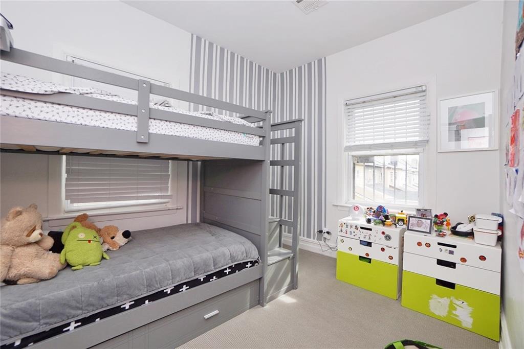 914 Avenue L Brooklyn, NY 11230 - Photo 21 of 27 a bedroom with bed and window