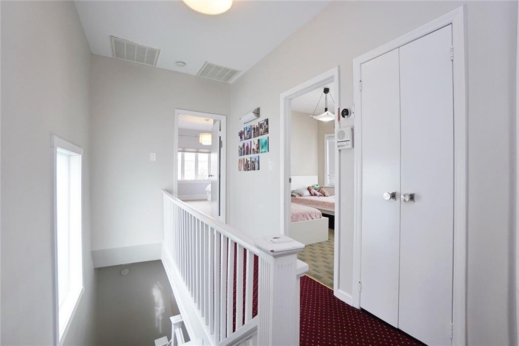 914 Avenue L Brooklyn, NY 11230 - Photo 23 of 27 a view of a hallway with wooden floor and entryway