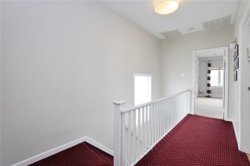 914 Avenue L Brooklyn, NY 11230 - Photo 24 of 27 a view of a hallway with a white walls