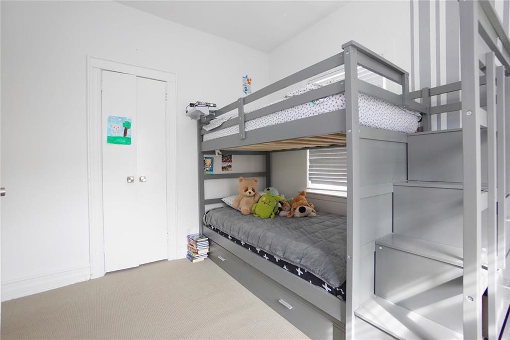 914 Avenue L Brooklyn, NY 11230 - Photo 27 of 27 a bedroom with a bed and a window