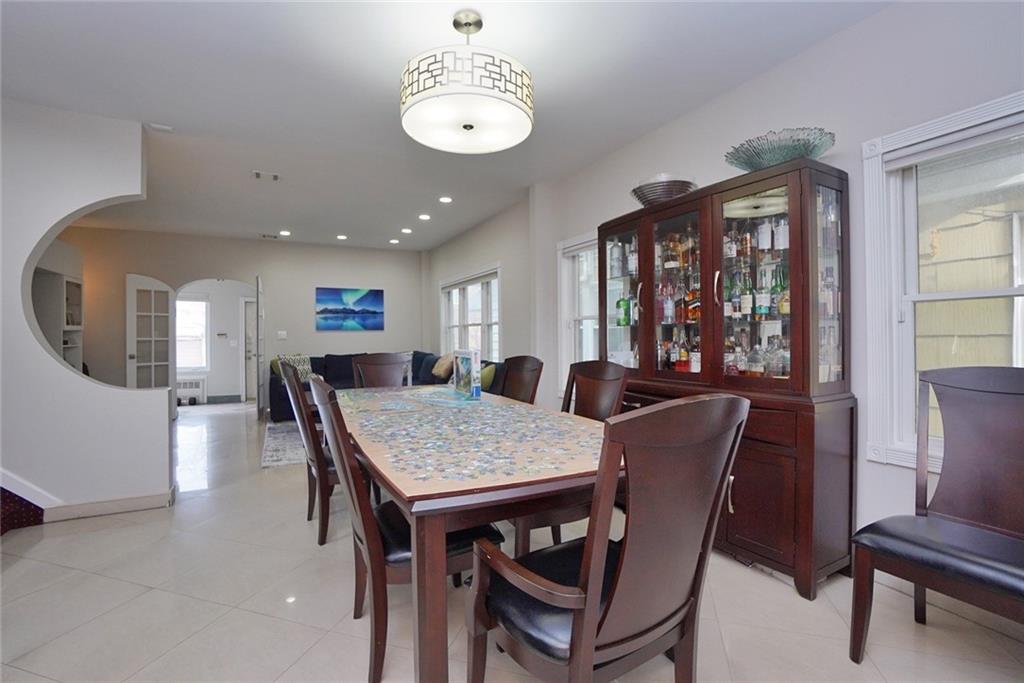 914 Avenue L Brooklyn, NY 11230 - Photo 9 of 27 a view of a dining room with furniture window and wooden floor