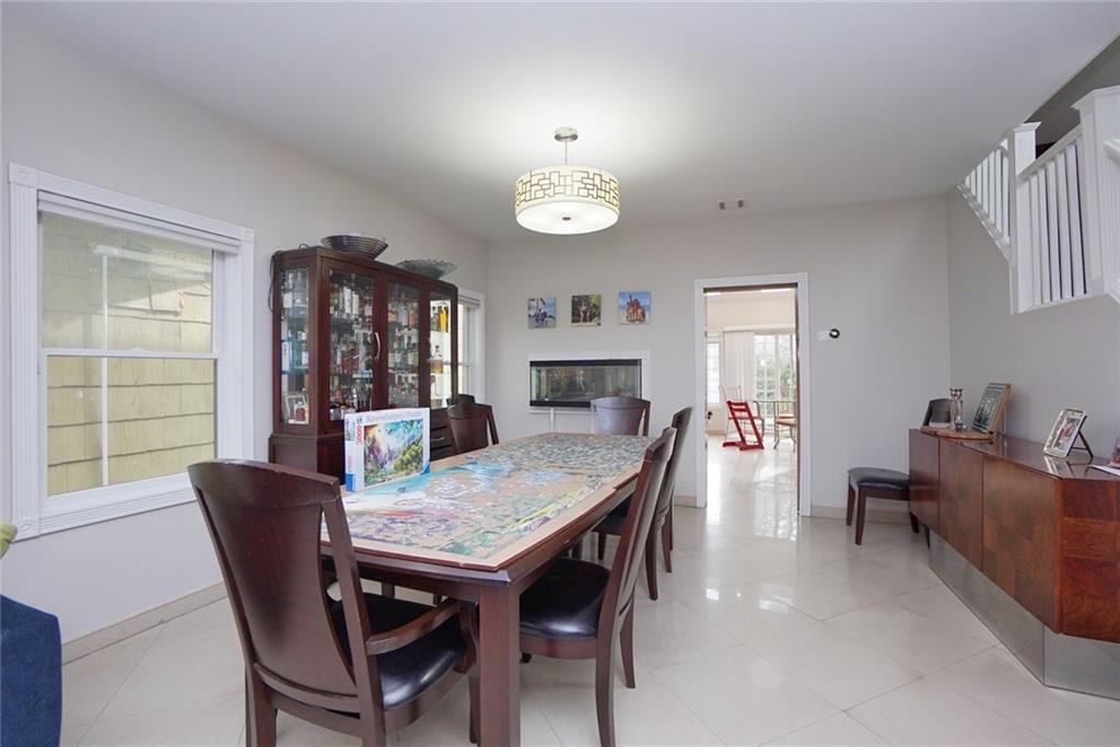 914 Avenue L Brooklyn, NY 11230 - Photo 10 of 27 a view of a dining room with furniture window and wooden floor
