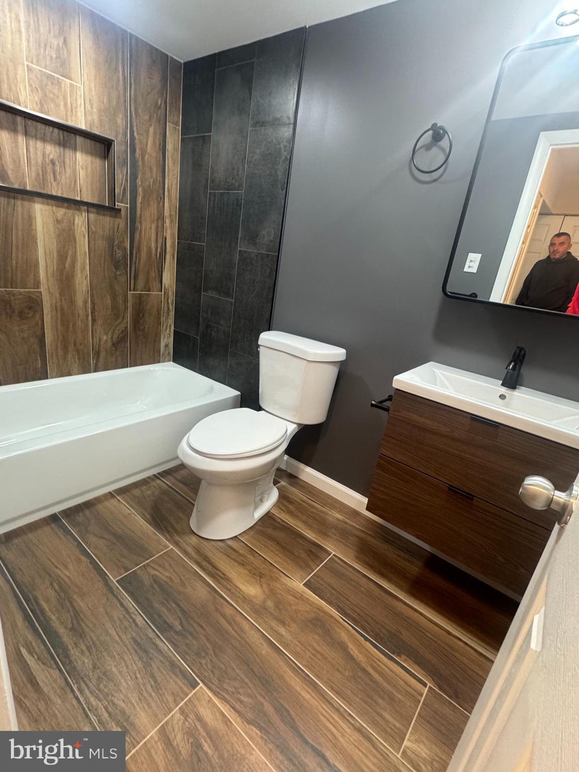 1023 Oakwood Drive, Unit 1 Huntingdon Valley, PA 19006 - Photo 1 of 6 a bathroom with a sink a toilet and shower