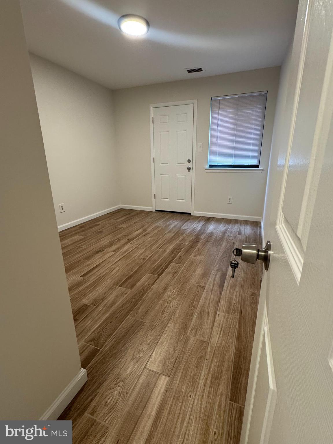 1023 Oakwood Drive, Unit 1 Huntingdon Valley, PA 19006 - Photo 2 of 6 a view of a room with wooden floor