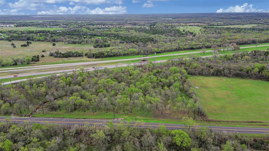 429 St Terrell Tx 75161 Terrell, TX 75161 - Photo 8 of 13 an aerial view of field with trees in the background