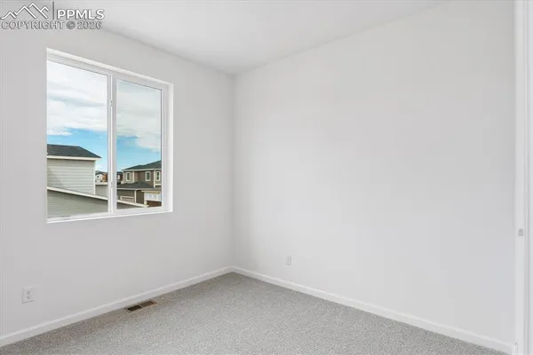 an empty room with a bathroom