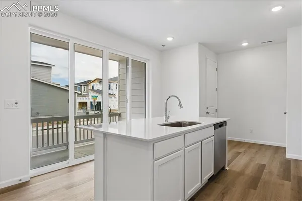 a kitchen with a sink and cabinets