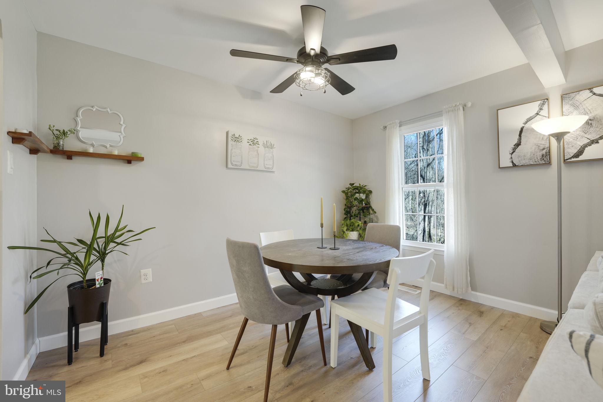 2310 Horseferry Court Reston, VA 20191 - Photo 11 of 49 a view of a dining room with furniture and wooden floor