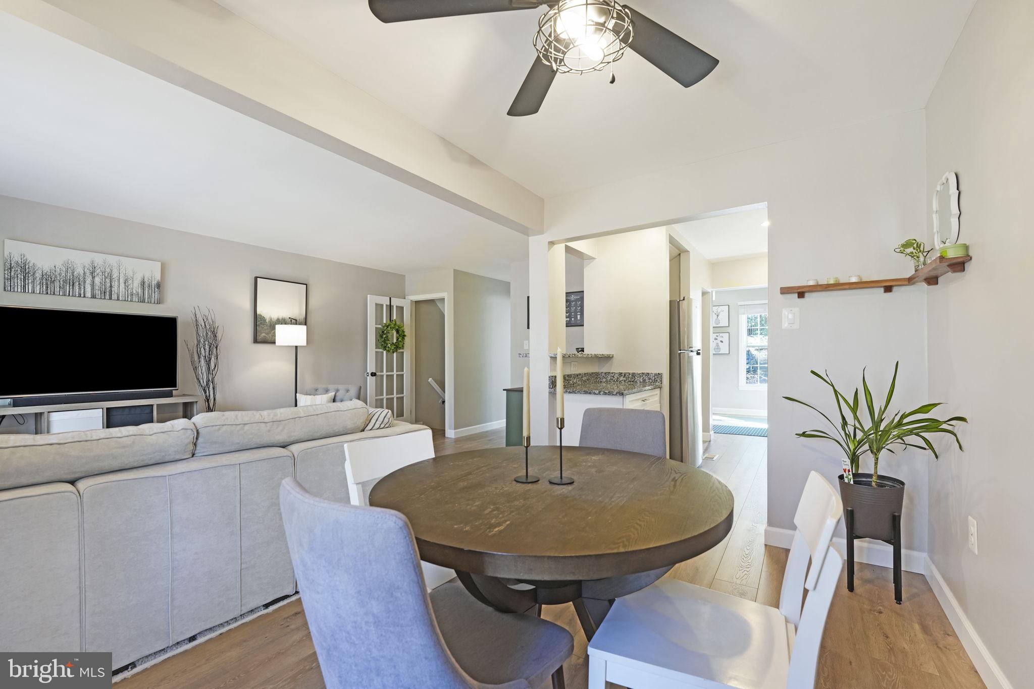 2310 Horseferry Court Reston, VA 20191 - Photo 12 of 49 a living room with furniture and a flat screen tv