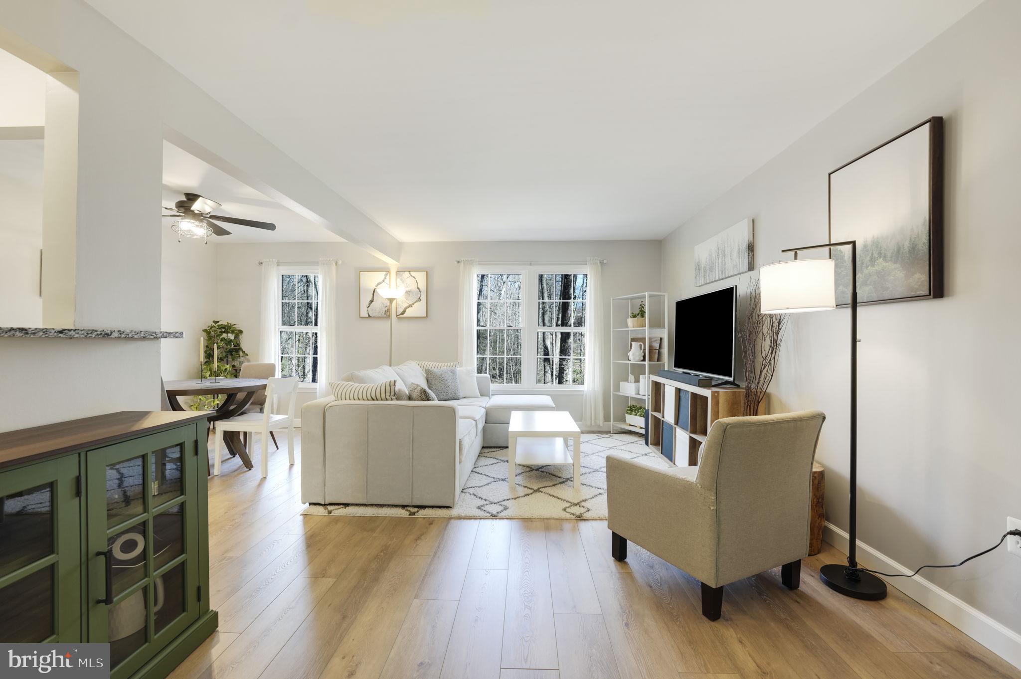 2310 Horseferry Court Reston, VA 20191 - Photo 14 of 49 a living room with furniture and a flat screen tv