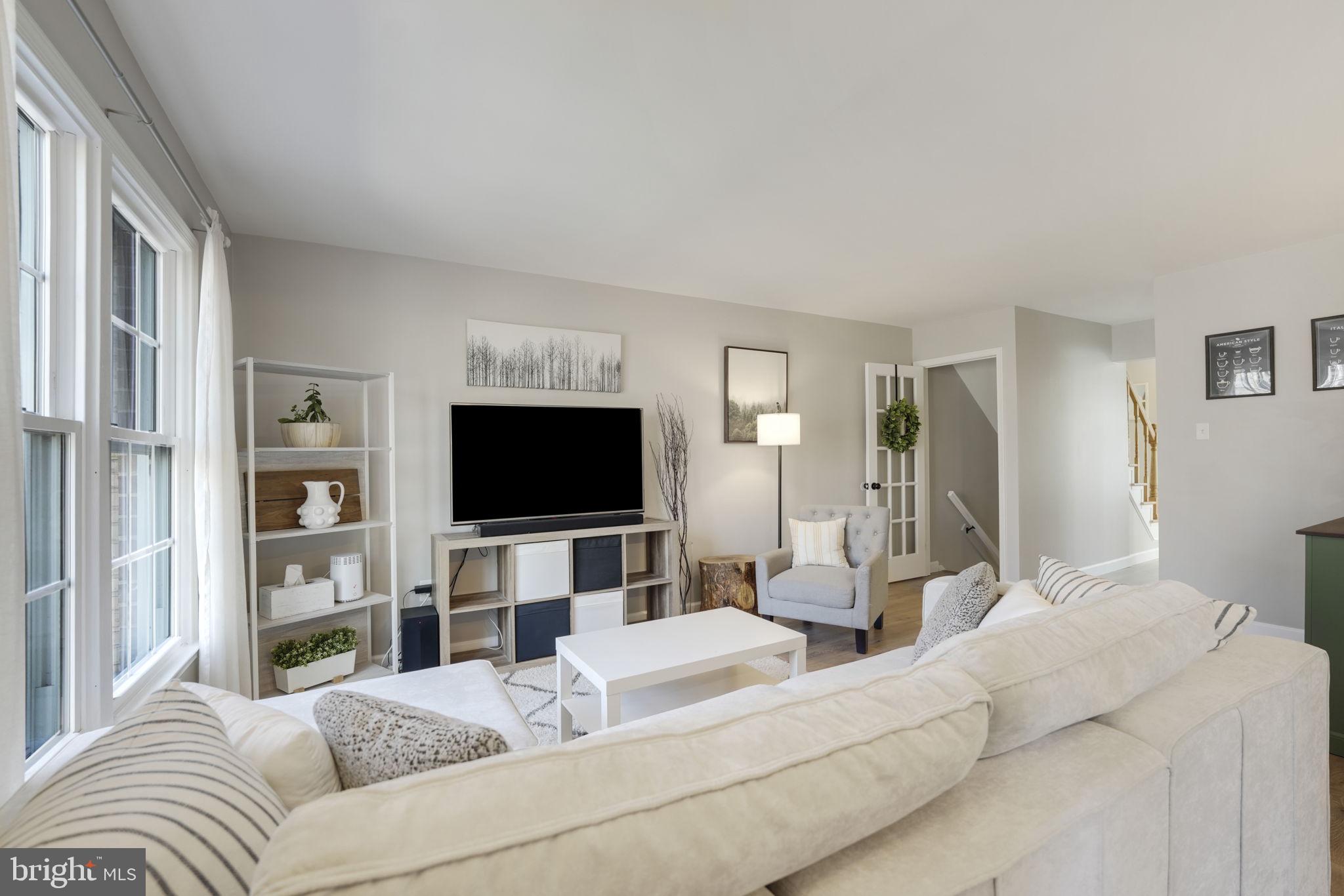 2310 Horseferry Court Reston, VA 20191 - Photo 18 of 49 a living room with furniture and a flat screen tv