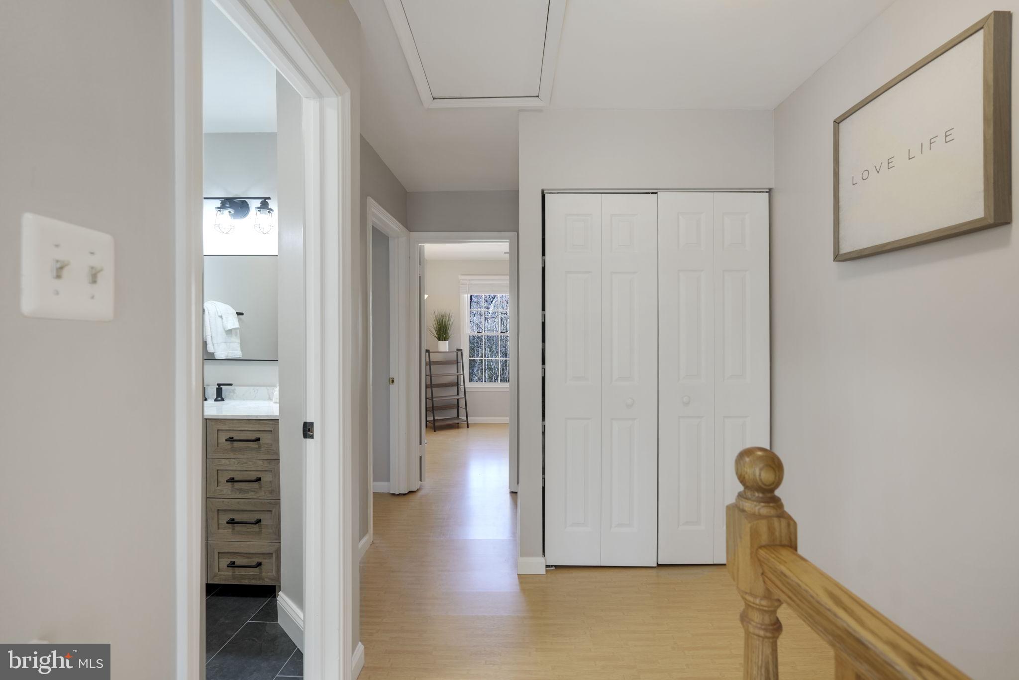 2310 Horseferry Court Reston, VA 20191 - Photo 21 of 49 a view of hallway with livingroom and wooden floor