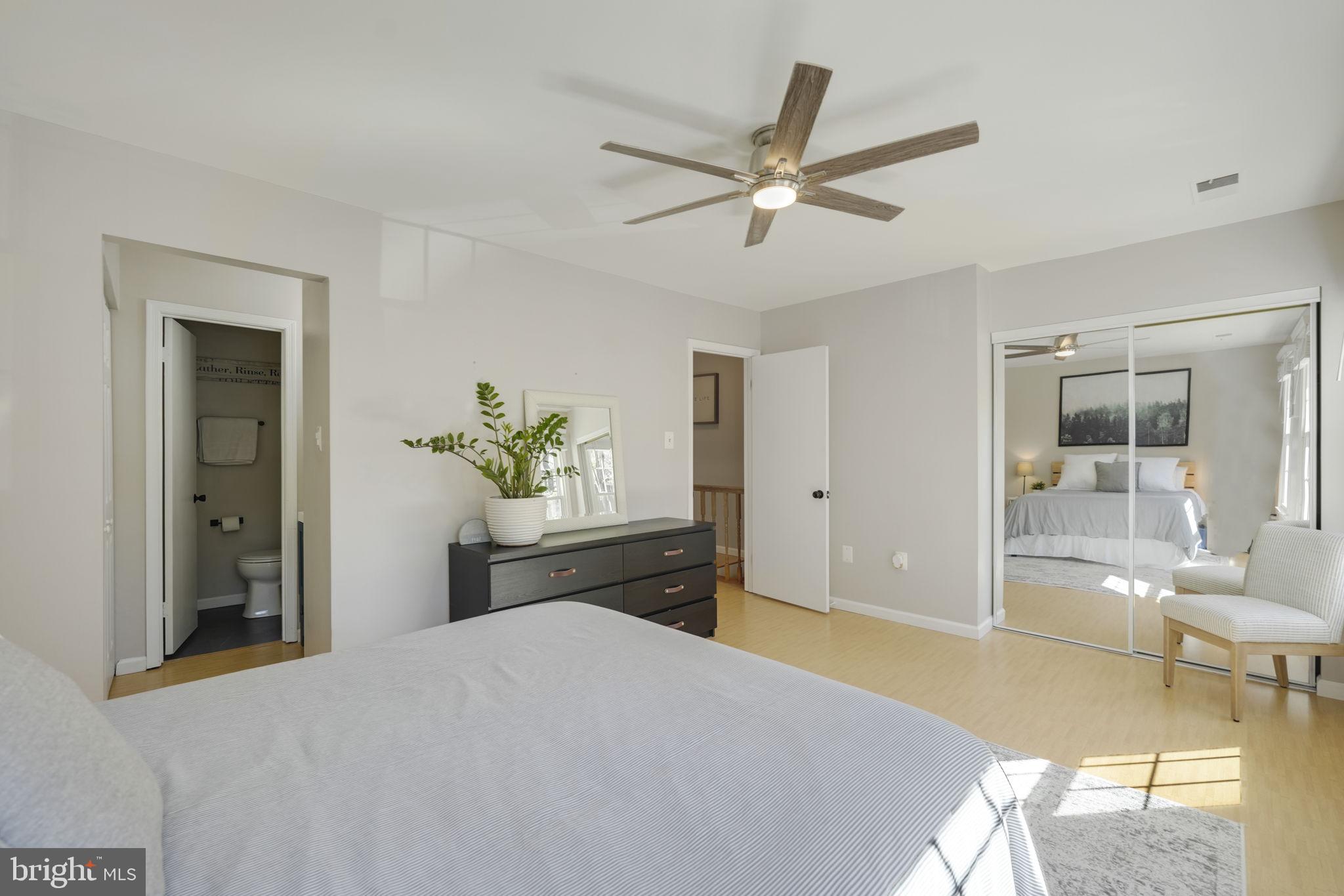 2310 Horseferry Court Reston, VA 20191 - Photo 24 of 49 a bedroom with a bed and a chandelier