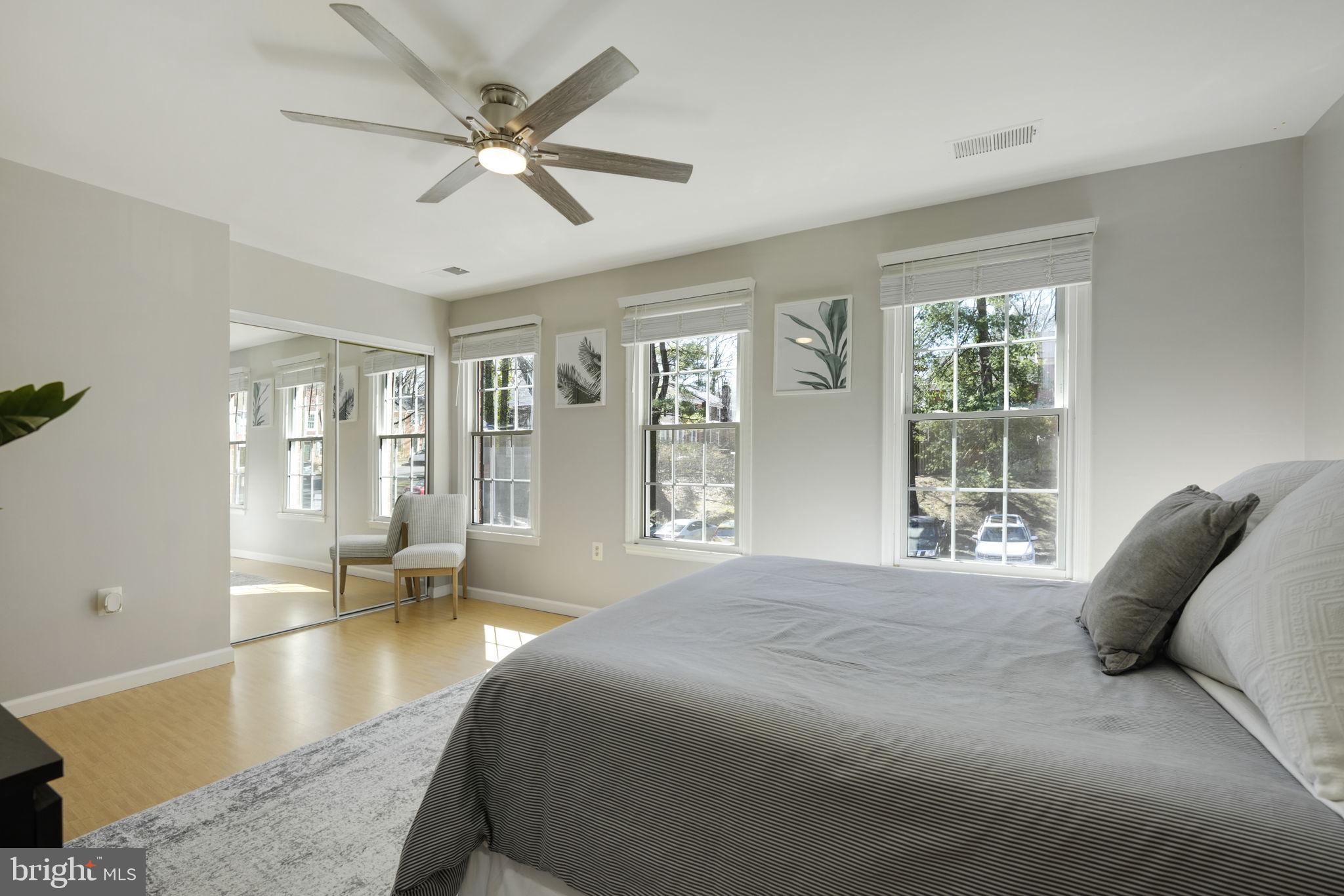 2310 Horseferry Court Reston, VA 20191 - Photo 25 of 49 a spacious bedroom with a large bed and a large window