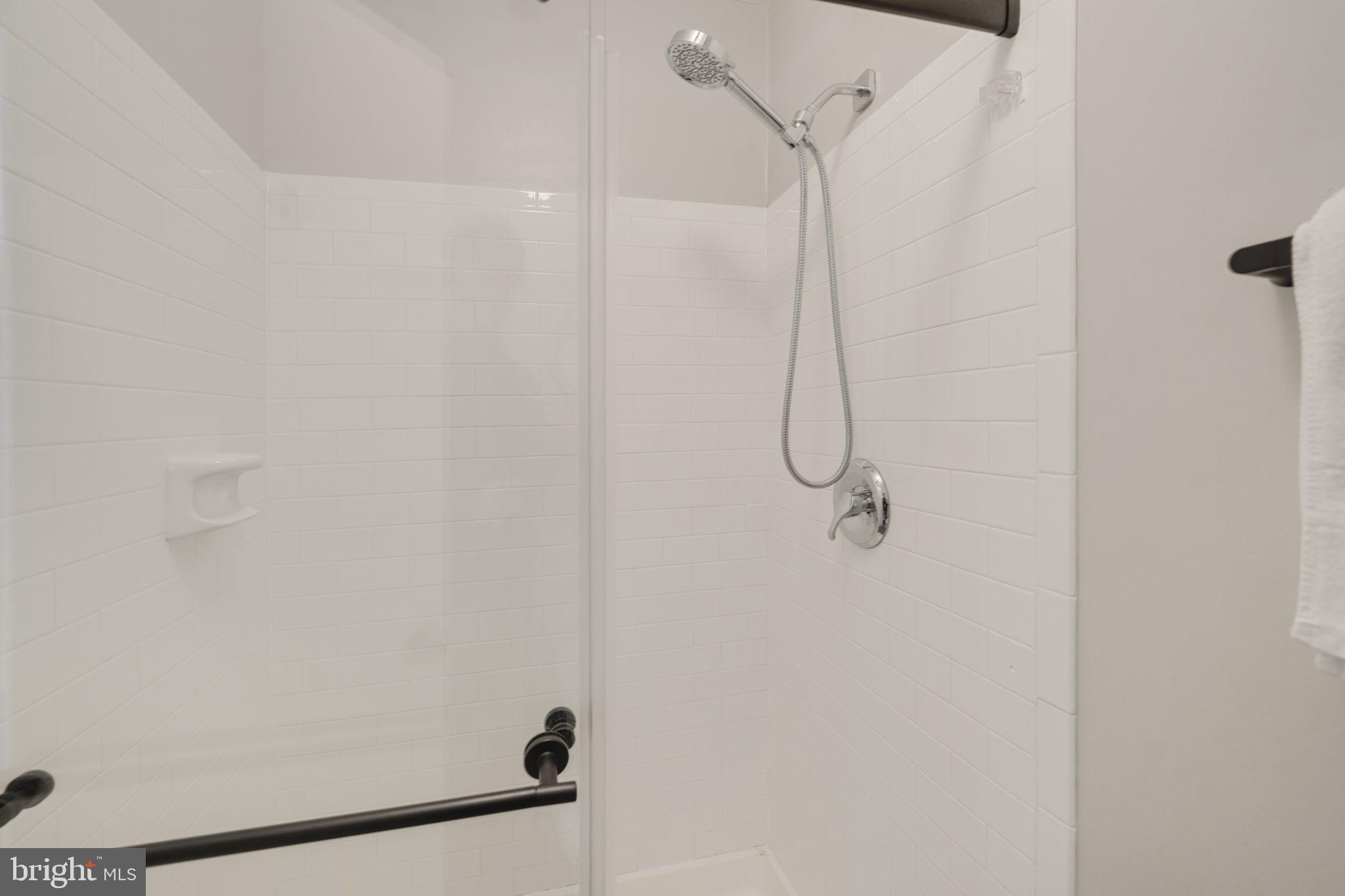 2310 Horseferry Court Reston, VA 20191 - Photo 27 of 49 a bathroom with a glass shower door
