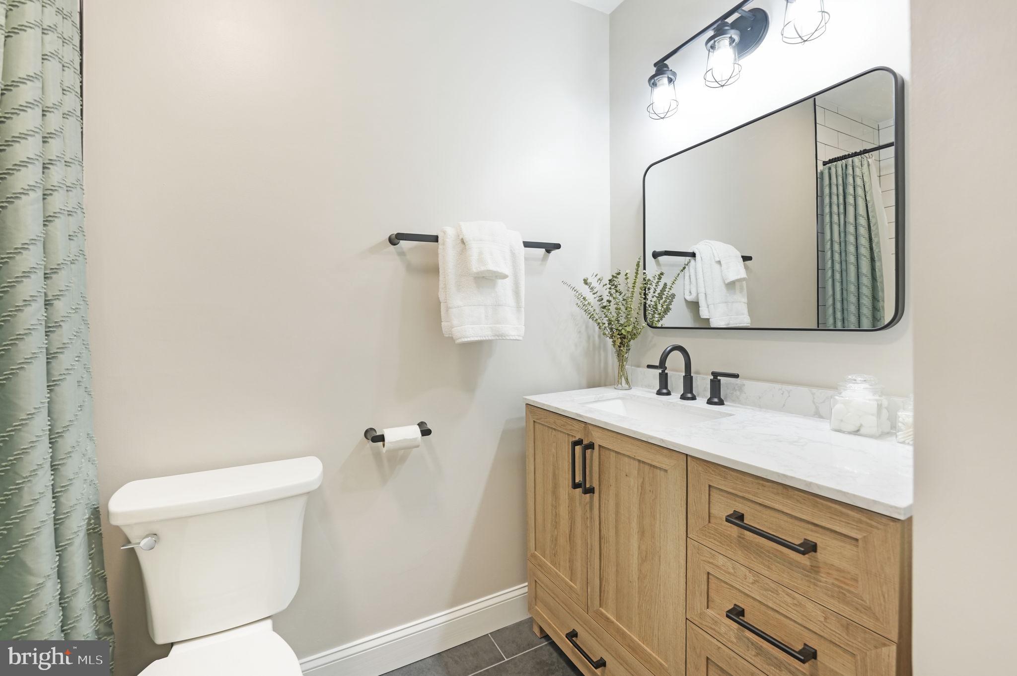 2310 Horseferry Court Reston, VA 20191 - Photo 30 of 49 a bathroom with a toilet sink and mirror