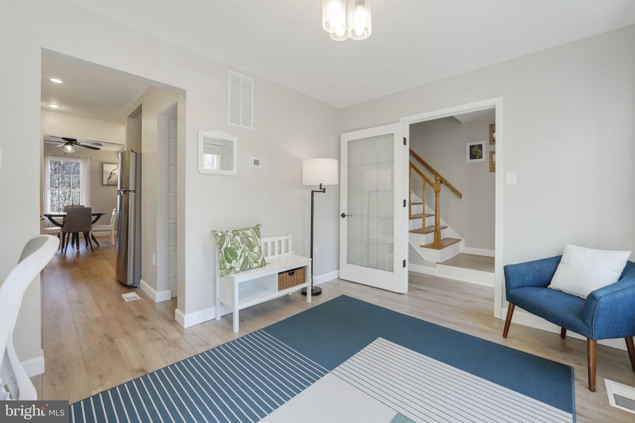 2310 Horseferry Court Reston, VA 20191 - Photo 3 of 49 a living room with furniture and a rug