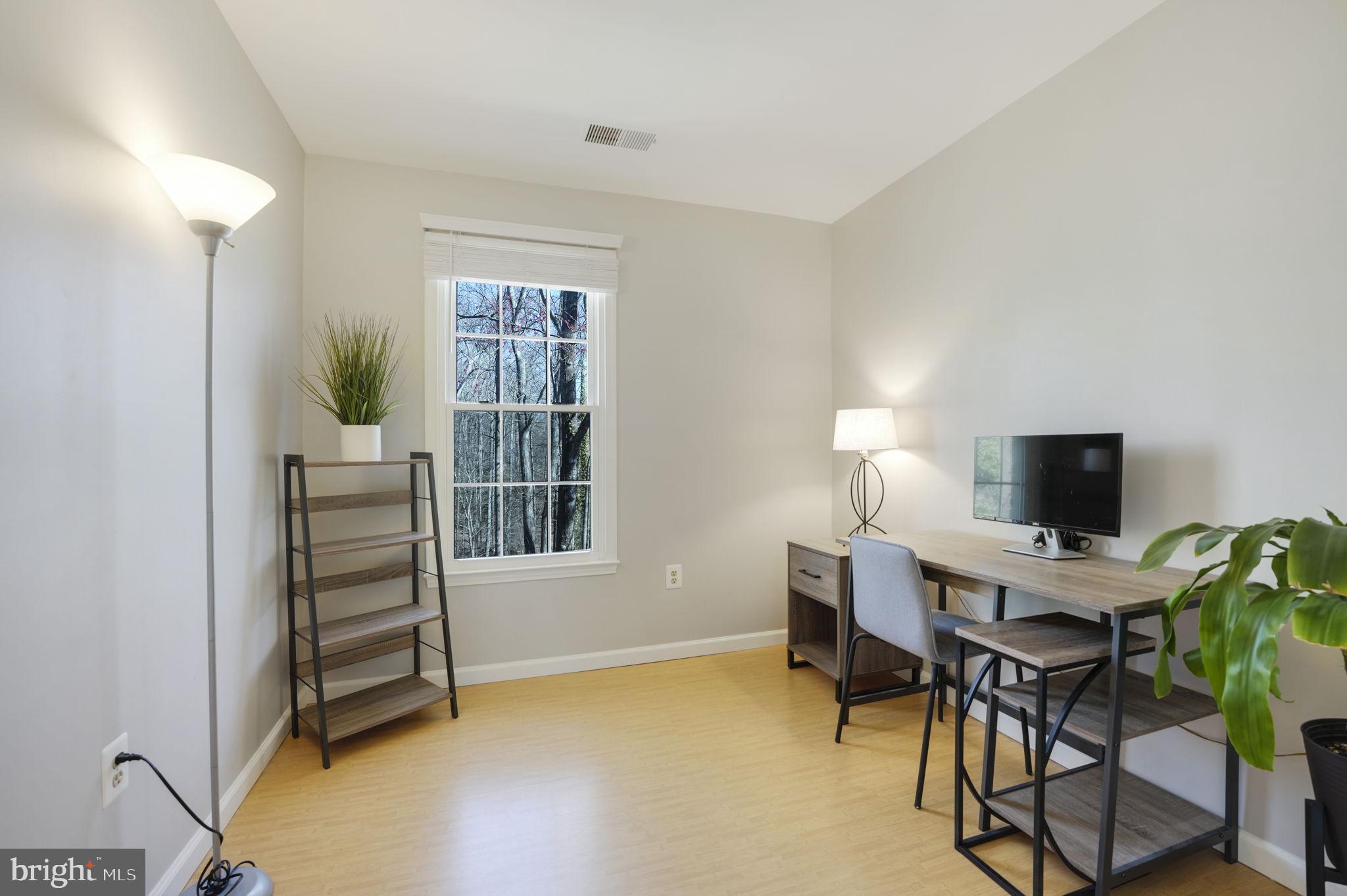 2310 Horseferry Court Reston, VA 20191 - Photo 32 of 49 a view of a workspace with furniture and a window