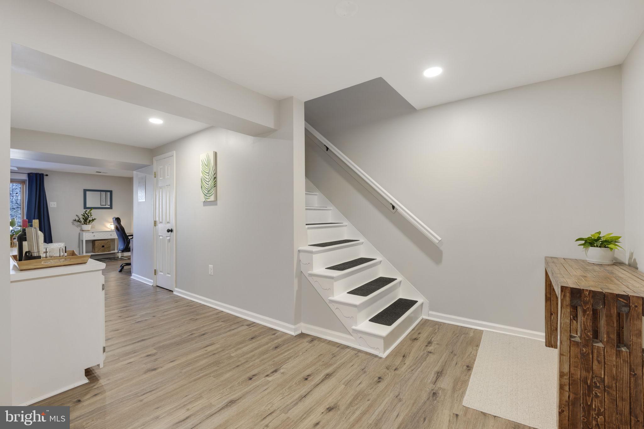 2310 Horseferry Court Reston, VA 20191 - Photo 34 of 49 a view of entryway and hall with wooden floor