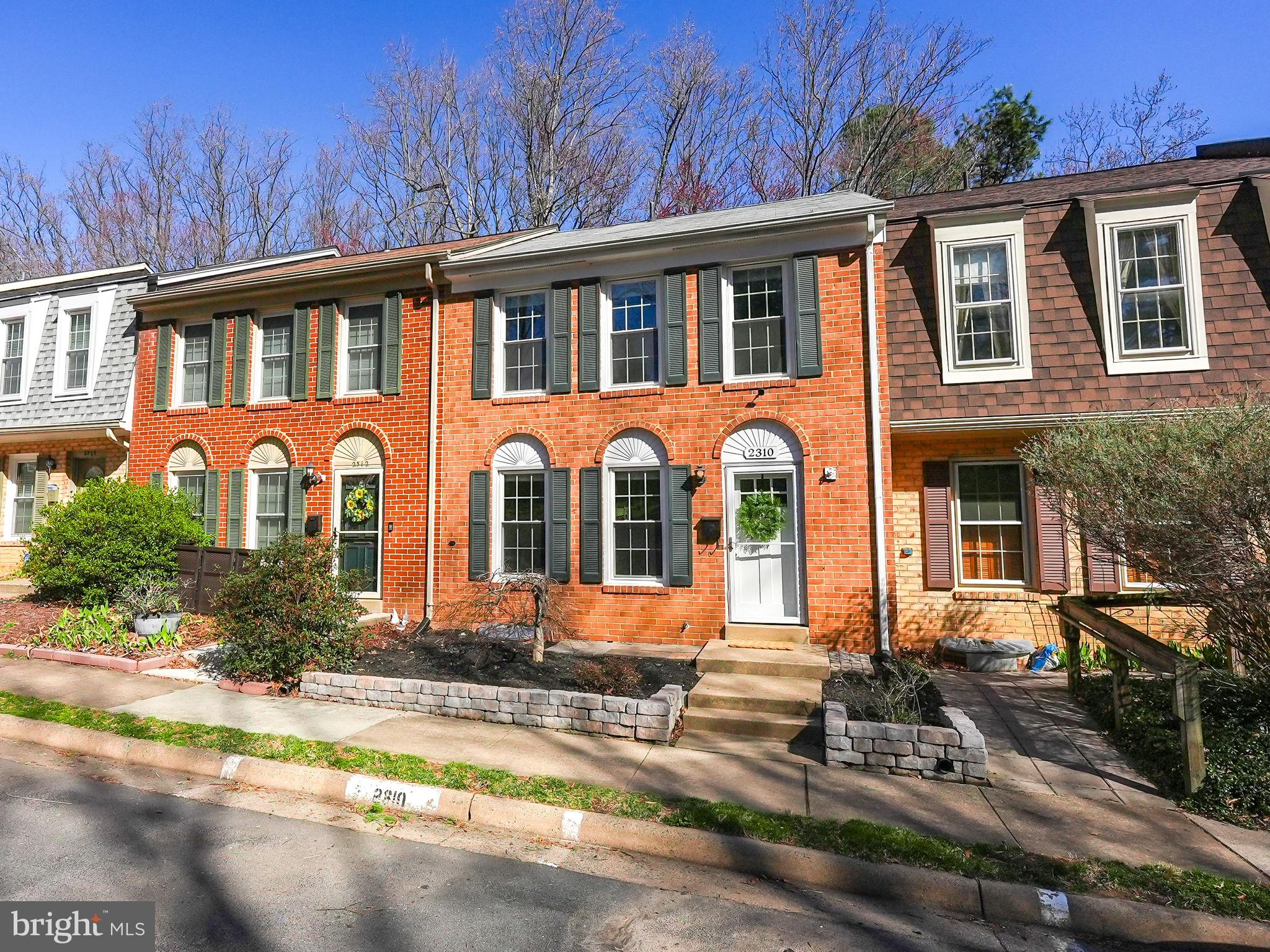 2310 Horseferry Court Reston, VA 20191 - Photo 49 of 49 a front view of a house with garden