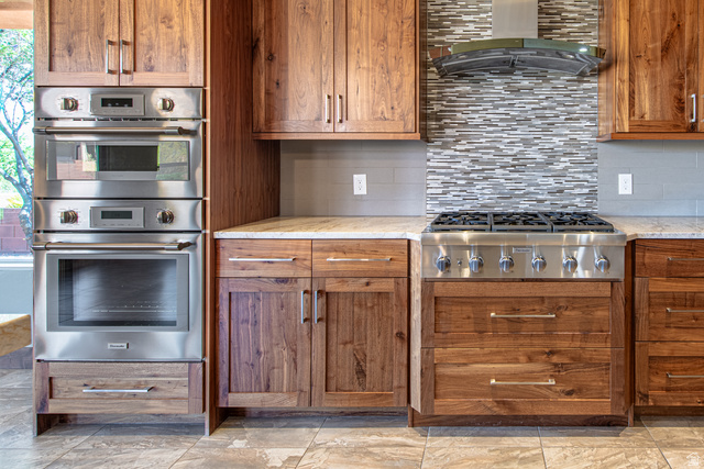 322 340 E Street Ivins, UT 84738 - Photo 15 of 61 Stainless steel range with a mosaic tile backsplash and overhead hood
