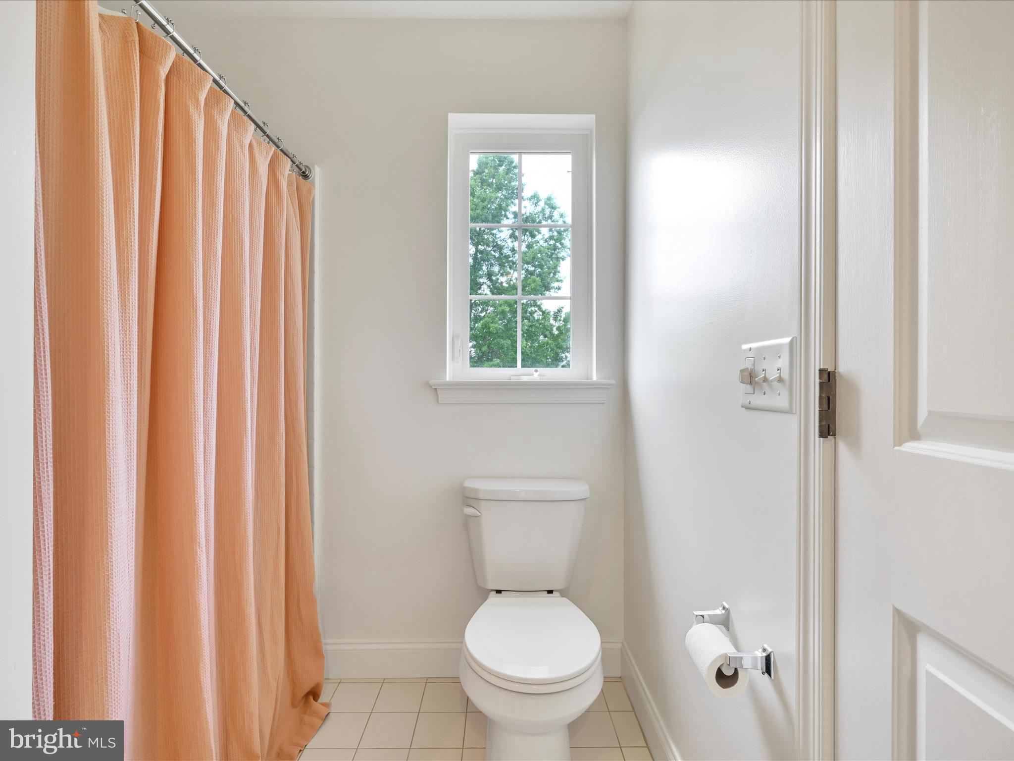 1082 Stillwood Circle Lititz, PA 17543 - Photo 22 of 44 a white toilet sitting next to a shower curtain