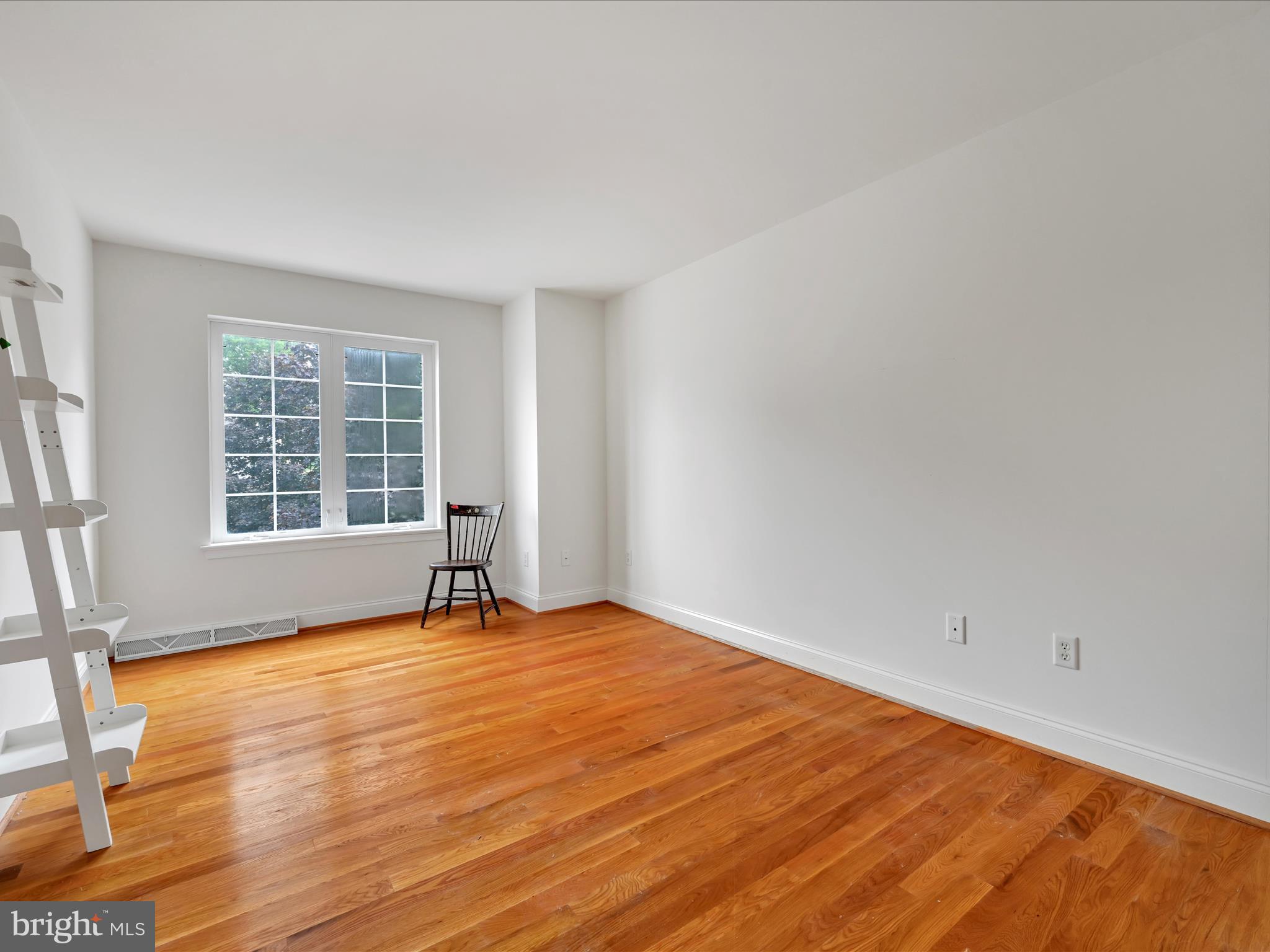 1082 Stillwood Circle Lititz, PA 17543 - Photo 23 of 44 a view of an empty room with a window and wooden floor