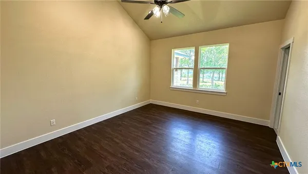 a room with cabinets and wooden floor