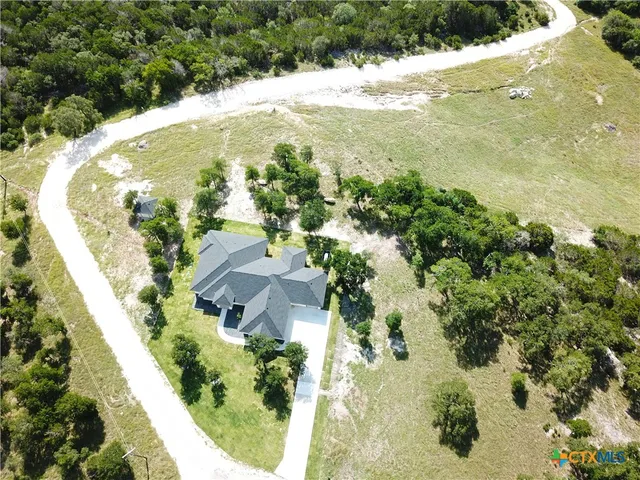 a house with swimming pool in front of it