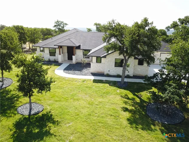 an aerial view of residential house with outdoor space