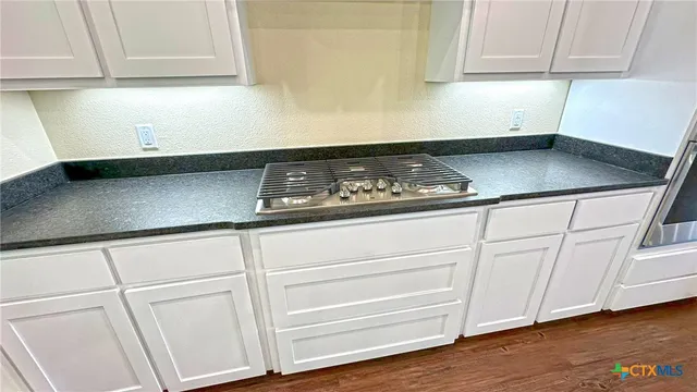 a kitchen with a sink and a window