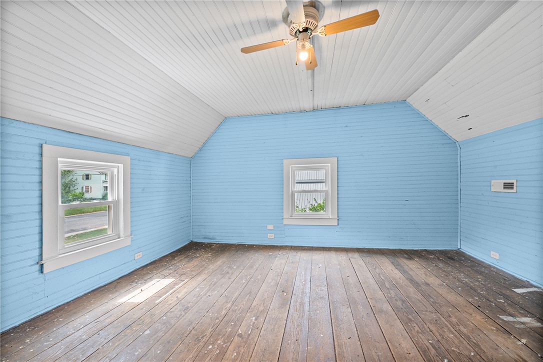 47 Square Street Pelzer, SC 29669 - Photo 27 of 29 Original wood floors and unique sloped beadboard ceilings define this upstairs bedroom space.