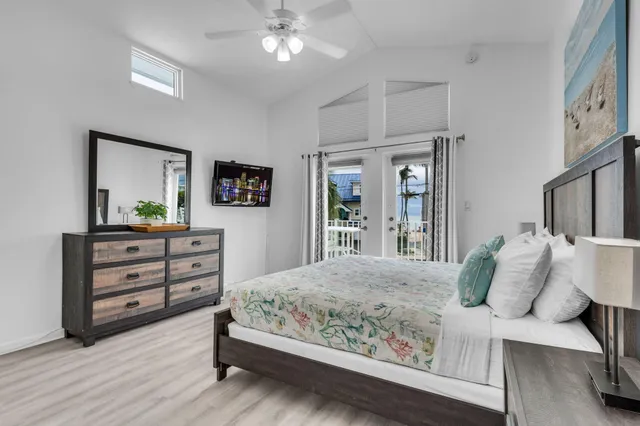 a bedroom with a bed and a night stand