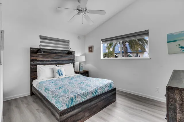 a bedroom with a bed and a dresser