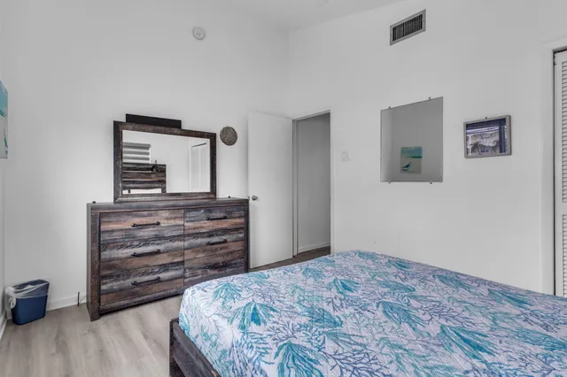a living room with furniture fireplace and a large window