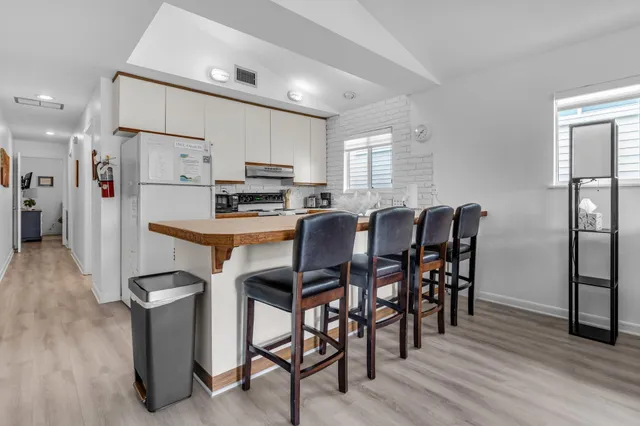 a kitchen with sink stove and center island