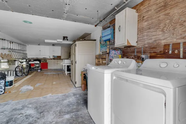 swimming pool view with a seating space