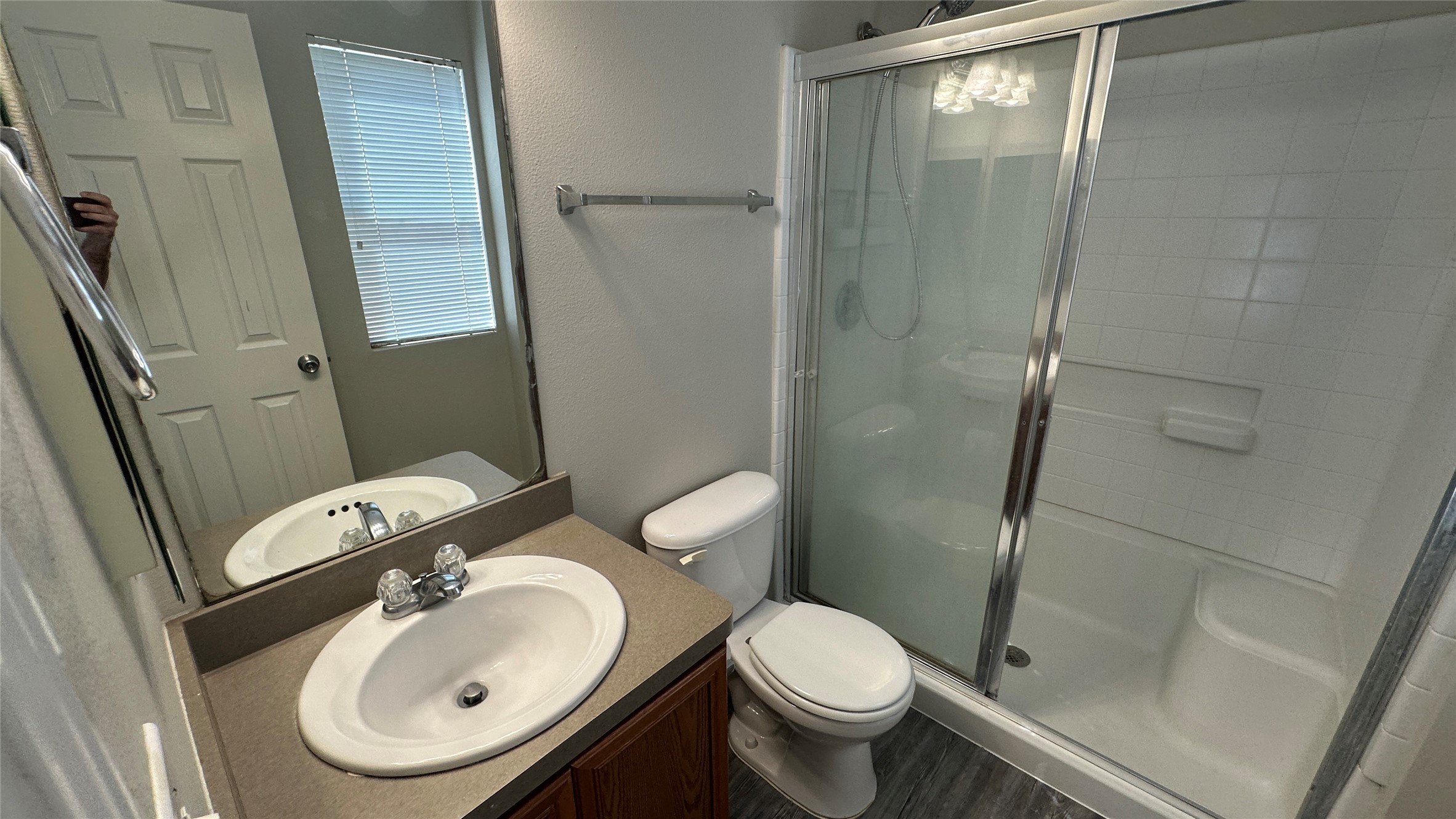 23851 Single Oak Street Spring, TX 77373 - Photo 12 of 15 a bathroom with a sink a toilet and shower a mirror