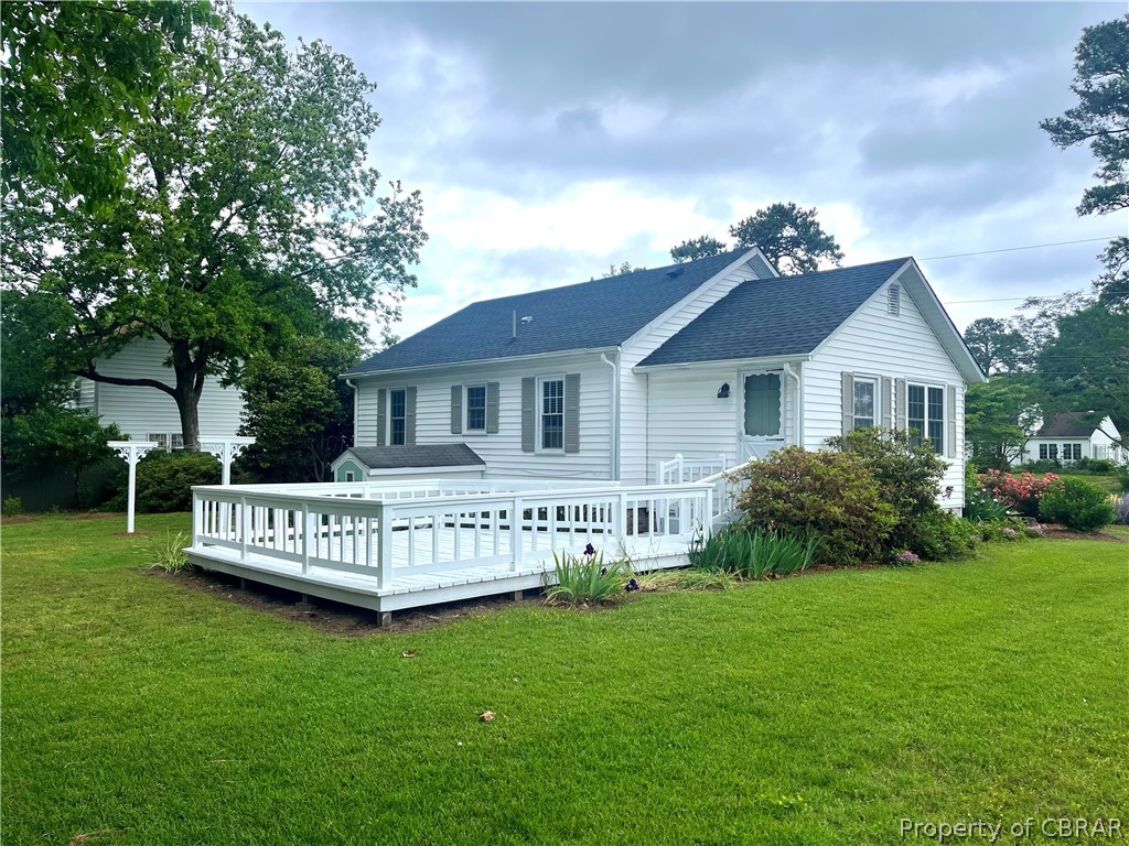 1438 Lafayette Road Gloucester Point, VA 23062 - Photo 2 of 34 Back of house featuring a deck and a lawn