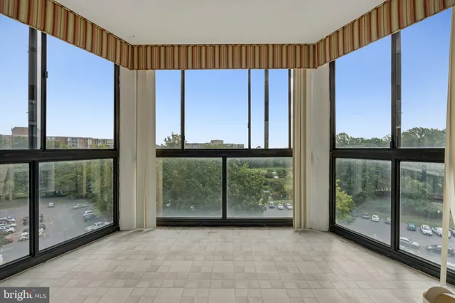 a view of a room with large windows