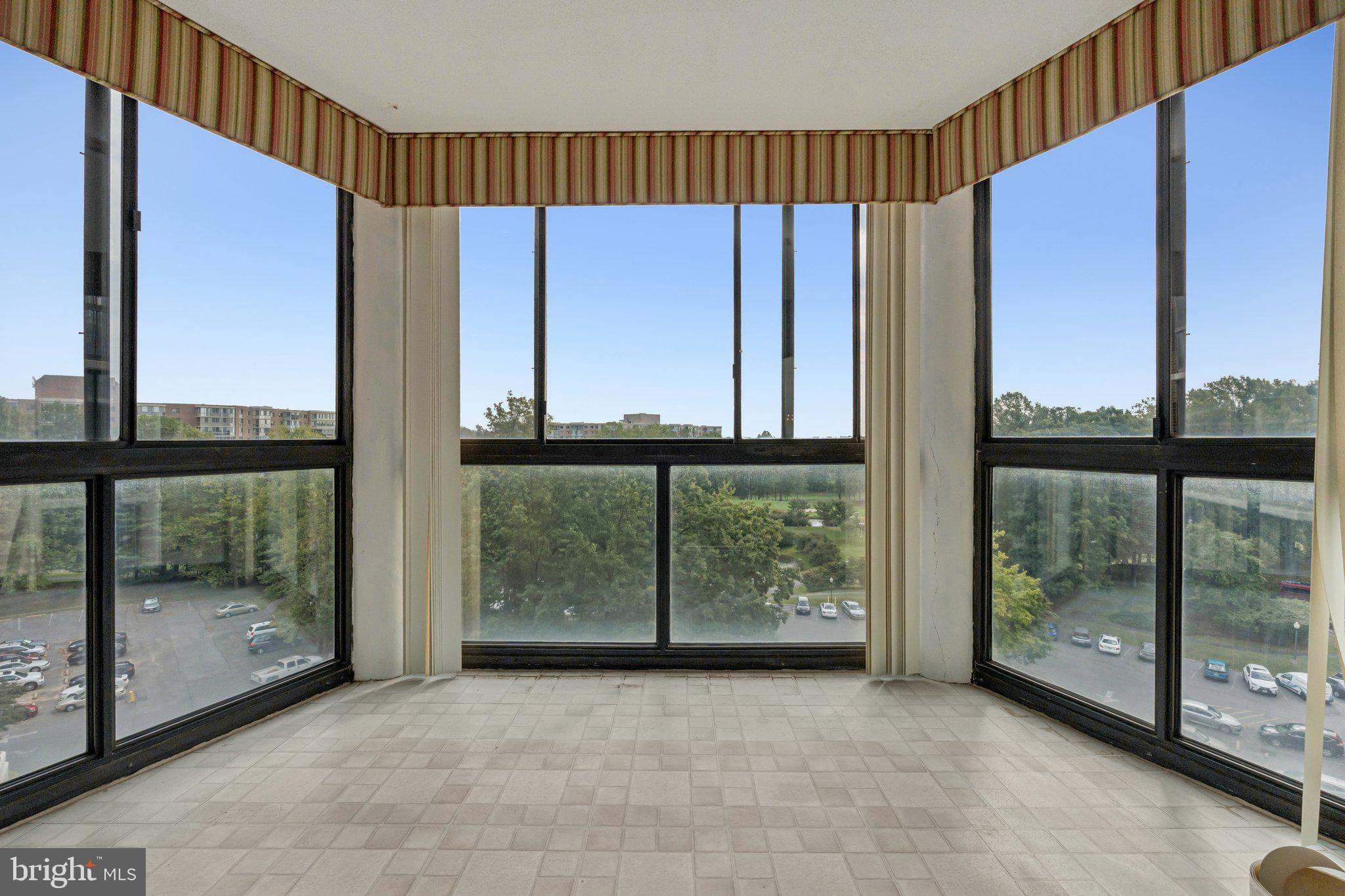 15115 Interlachen Drive, Unit 3815 Silver Spring, MD 20906 - Photo 18 of 27 a view of a room with large windows