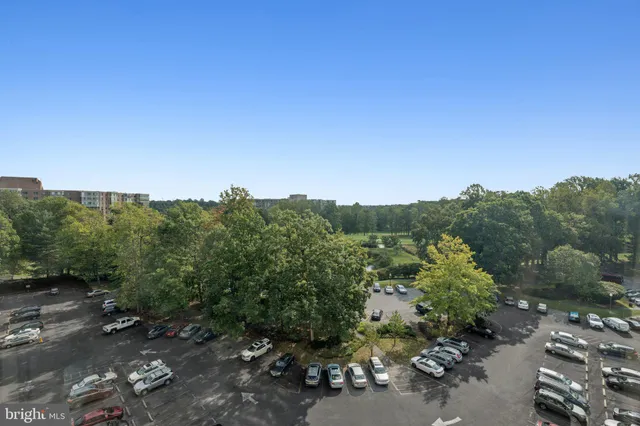 a lobby with furniture and a chandelier
